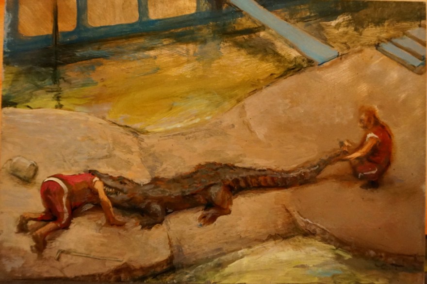 man-with-his-head-stuck-in-a-crocodile-on-tin